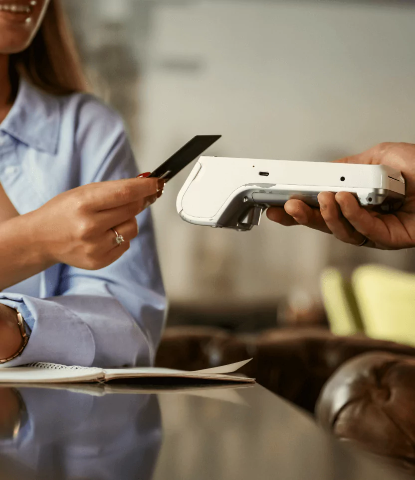 Customer making a quick card payment on a mobile POS system terminal